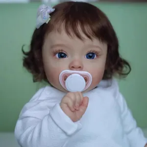 60cm realistic reborn baby doll with curly brown hair, blue eyes and white outfit