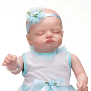Poupée Reborn réaliste Rosalie de 49cm dormant en robe bleue et bandeau à fleurs