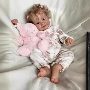 60cm realistic reborn baby Maddie doll in floral outfit with a pink plush bear