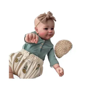 60cm Reborn Toddler Maddie Doll in mint green shirt and lemon print bloomers on white backdrop