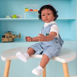 Detail of 60cm dark brown skin boy reborn doll in blue striped overalls and cap