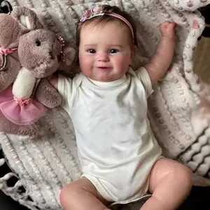 Poupée bébé reborn 50cm réaliste en body blanc avec bandeau rose et ours en peluche