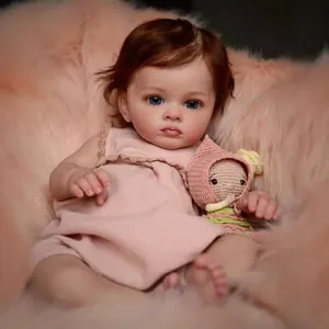 Realistic 60cm reborn toddler doll with blue eyes and pink polka dot sleeveless outfit