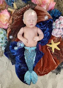 Detail view of 25 inch Rhynn Merbaby reborn doll kit with realistic scales and sea decor