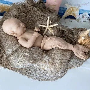 25-inch Rhynn Merbaby reborn doll DIY kit with mermaid tail and elf ears on a fishing net