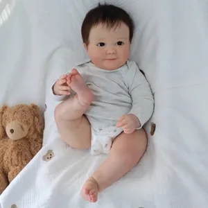 Realistic 60cm Reborn Baby Doll with 3D skin texture and gray long sleeve romper