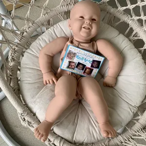 Realistic 24-inch Kodi reborn baby doll in brown romper with limited edition certificate