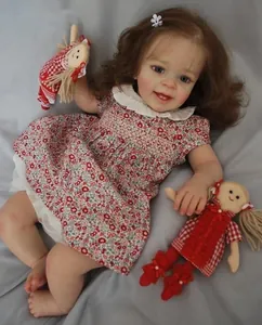 Detailed close-up of 60cm lifelike reborn doll with realistic skin texture and floral dress