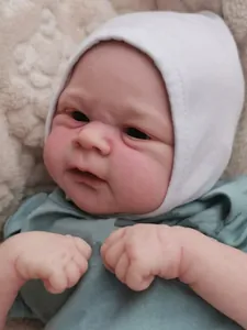 Close-up of lifelike 3D painted skin details and texture on the reborn baby doll's face
