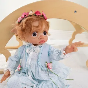 Detailed view of 17-inch elf reborn doll with orange curls and floral lace outfit