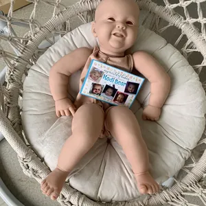 24-inch lifelike Reborn Doll Kodi Bear kit with authenticity certificate in a woven swing