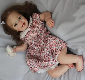 Close-up of Yannik reborn doll with realistic skin texture and floral dress detail