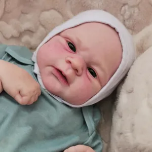 Realistic Elijah reborn baby doll with 3D hand-painted skin in green knit outfit