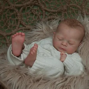 Realistic 46cm reborn baby doll sleeping in knit sweater and woven basket cradle