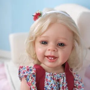 Lifelike 55cm Yannik reborn baby doll with 3D skin texture, blonde hair, and floral dress