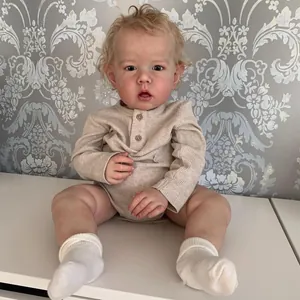 Realistic 75cm reborn toddler Liam doll in beige ribbed romper and white socks
