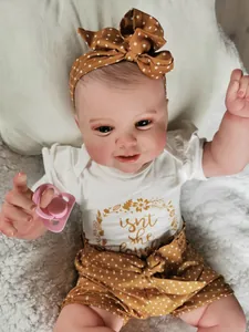 Detail of 60cm reborn doll with 3D skin and hand-rooted lashes in white bodysuit