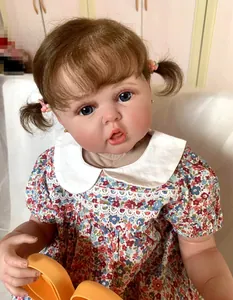 Detail of 60cm reborn doll featuring realistic 3D skin veins and brown twin pigtails