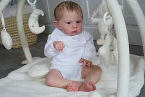 Detailed close-up of 60cm lifelike reborn baby boy doll with 3D skin texture and veins