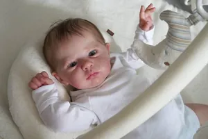 Macro shot of 60cm reborn baby doll featuring realistic 3D skin veins and hand-rooted hair