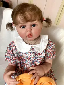 Detailed close-up of 60cm reborn doll with 3D skin texture and realistic floral outfit