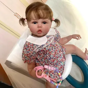 60cm reborn baby doll with 3D skin and visible veins in floral dress and pacifier