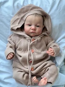 Detailed close-up of 49cm Levi awake reborn doll in earth-tone knit hooded romper