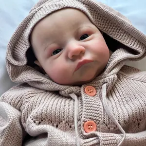 Realistic 49cm reborn baby doll Levi awake wearing a pink hooded knitted sweater