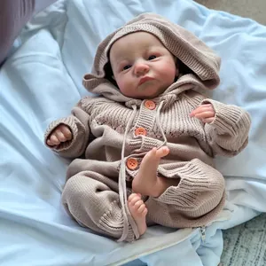 Realistic 49cm reborn baby doll Levi awake in a cozy brown knitted hooded romper suit