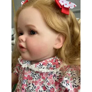 Poupée reborn réaliste Betty de 60cm avec veines visibles et cheveux bouclés dorés