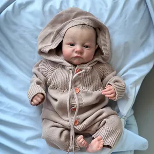Realistic 49cm reborn baby doll Levi awake in a pink hooded waffle knit romper