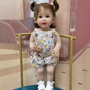 55cm lifelike reborn doll in floral romper with pigtails and white sandals on velvet base
