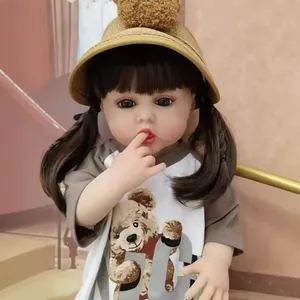 55cm lifelike reborn baby doll with twin pigtails and bear t-shirt on stairs