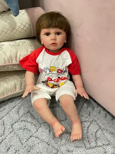 Close-up of 60cm reborn boy doll with realistic 3D skin and red cartoon romper