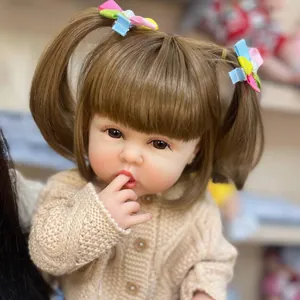 55cm lifelike reborn baby doll in knit sweater sucking thumb with brown pigtails