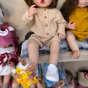 Lifelike 55cm reborn baby doll in apricot knit sweater set with white infant shoes