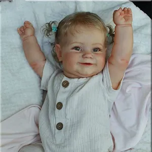 Reborn baby doll Maddie with realistic 3D skin texture and white striped romper