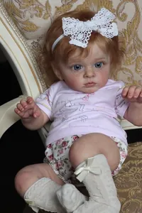Close-up of realistic 60cm reborn baby doll with blue eyes and detailed 3D skin texture