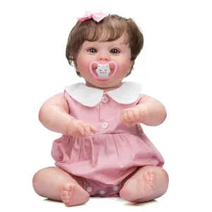 Lifelike 50cm reborn baby doll in pink dress with floral headband and kitten pacifier