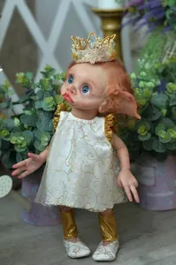 Detailed view of handmade fairy baby doll with 3D painted skin and gold embroidery dress