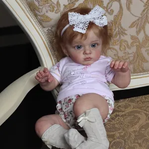 Lifelike 60cm reborn baby doll with 3D skin veins and curly hair on elegant chair