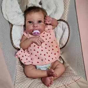 50cm lifelike reborn baby doll with pink ladybug bib, pacifier and soft cradle accessories