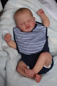 Macro shot of 19 inch reborn baby doll Sam showing realistic skin texture and sleeping face