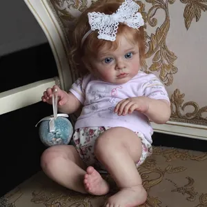 Realistic 60cm reborn doll with 3D skin veins, brown curls, and floral outfit on chair
