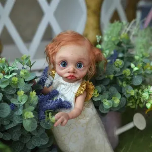 Handcrafted 16 inch realistic elf doll with blue eyes and white patterned dress