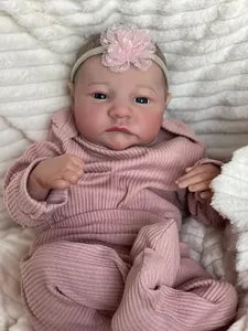 Close-up of 49cm reborn baby doll Levi featuring realistic skin texture and lace headband