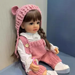 Poupée bébé reborn 55cm réaliste avec tenue rose en tricot et tresses brunes