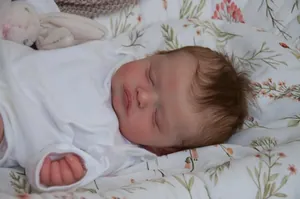 Detailed close-up of realistic newborn skin texture and veins on a sleeping reborn doll