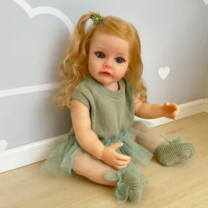 Realistische 55 cm Babypuppe, blond, Gänseblümchen-Clip, grünes Strickkleid und Tütü