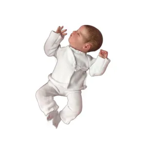 Realistic 10 inch newborn baby doll in white knitted outfit closed eyes sleeping pose